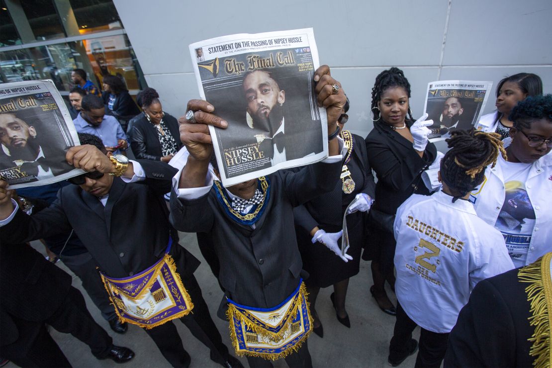 Masons attend a memorial celebration for Nipsey Hussle. 