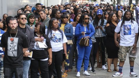 Fans of rapper Nipsey Hussle wait in line to attend a public memorial at Staples Center on Thursday.