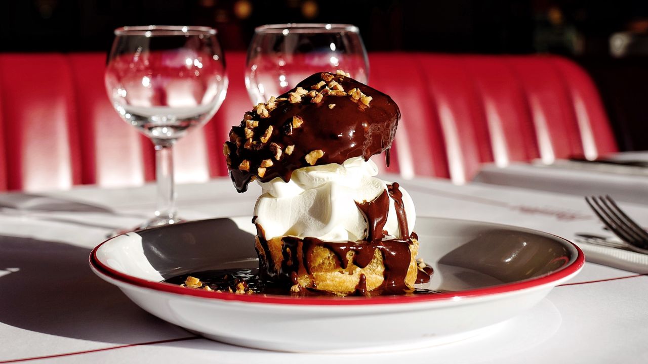 <strong>Dessert decadence: </strong>Profiteroles drenched in chocolate sauce are one of Pigalle's classic last-bite offerings.