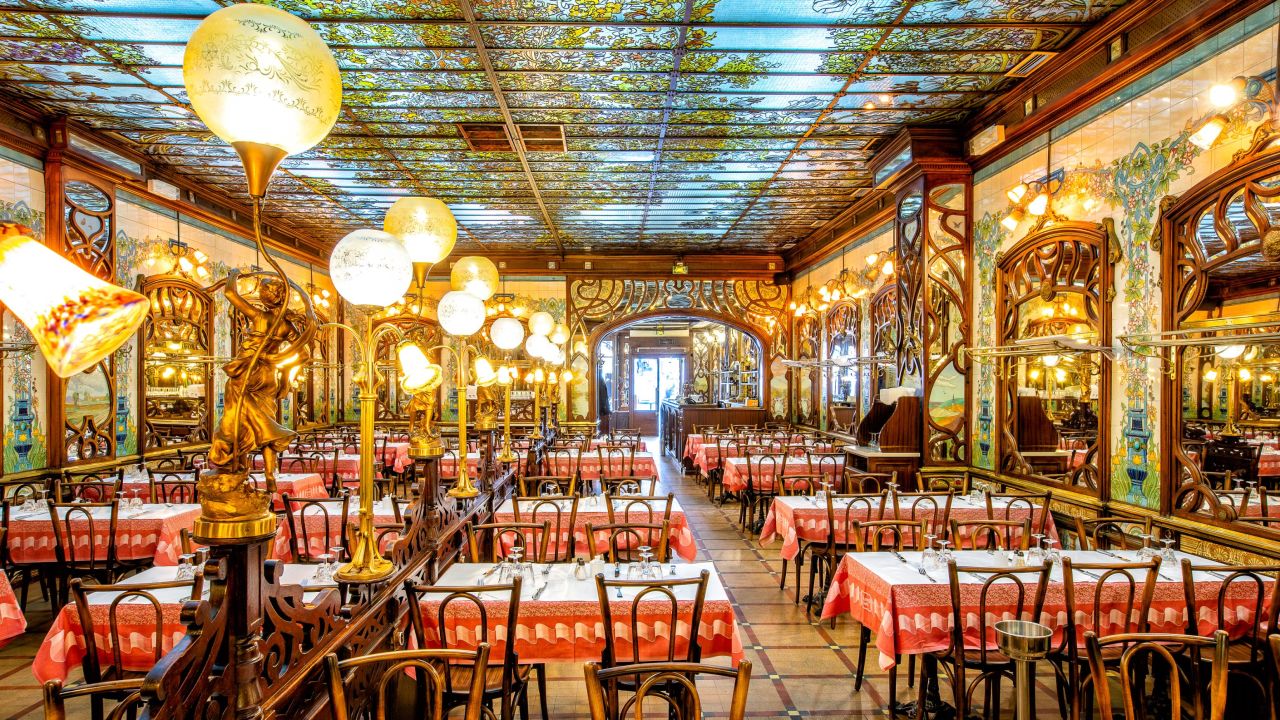 <strong>Art Nouveau decor: </strong>Bouillon Chartier Montparnasse's painted glass ceilings, orb light fixtures and ceramic tiled walls make dining here a treat in and of itself.