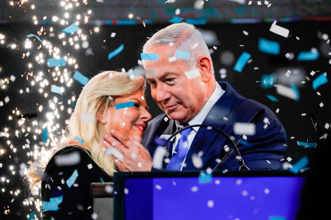 Israeli PM Benjamin Netanyahu embraces his wife Sara at Likud Party headquarters in Tel Aviv on election night on April 10, 2019.