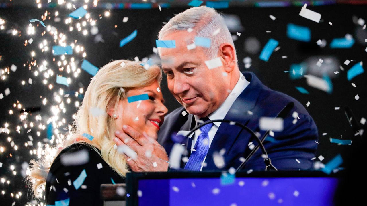 Israeli PM Benjamin Netanyahu embraces his wife Sara at Likud Party headquarters in Tel Aviv on election night on April 10, 2019.