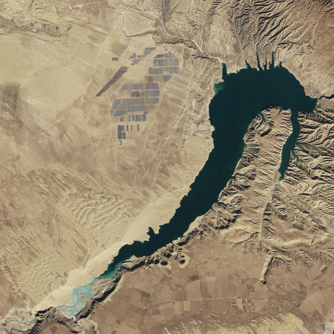 Captured by <a href="https://earthobservatory.nasa.gov/images/89668/longyangxia-dam-solar-park" target="_blank" target="_blank">NASA's Landsat 8 satellite</a> in January 2017, the Longyangxia Dam Solar Park in Qinghai province has a capacity of 850 megawatts. At the time the site had a reported <a href="https://www.climatecentral.org/news/china-solar-farm-satellite-21182" target="_blank" target="_blank">4 million solar panels</a>, part of a wider effort by China to produce 110 gigawatts of solar power by 2020.<br />