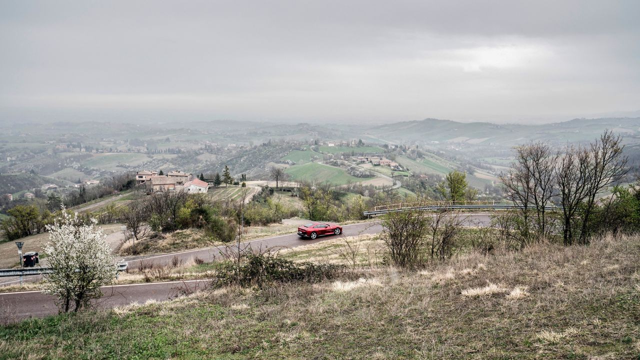 De Simone test drives a Ferrari Portofino on the hills around Maranello.