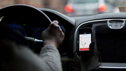 The Uber Technologies Inc. application runs on an Apple Inc. iPhone during an Uber ride in Washington, D.C., U.S., on Wednesday, April 8, 2015. Last month, Uber accounted for 47 percent of all rides expensed by employees whose companies use Certify, the second-largest provider of travel and expense management software in North America. In March 2014, Uber accounted for only 15 percent, according to a study by Certify released on April 7. Photographer: Andrew Harrer/Bloomberg via Getty Images