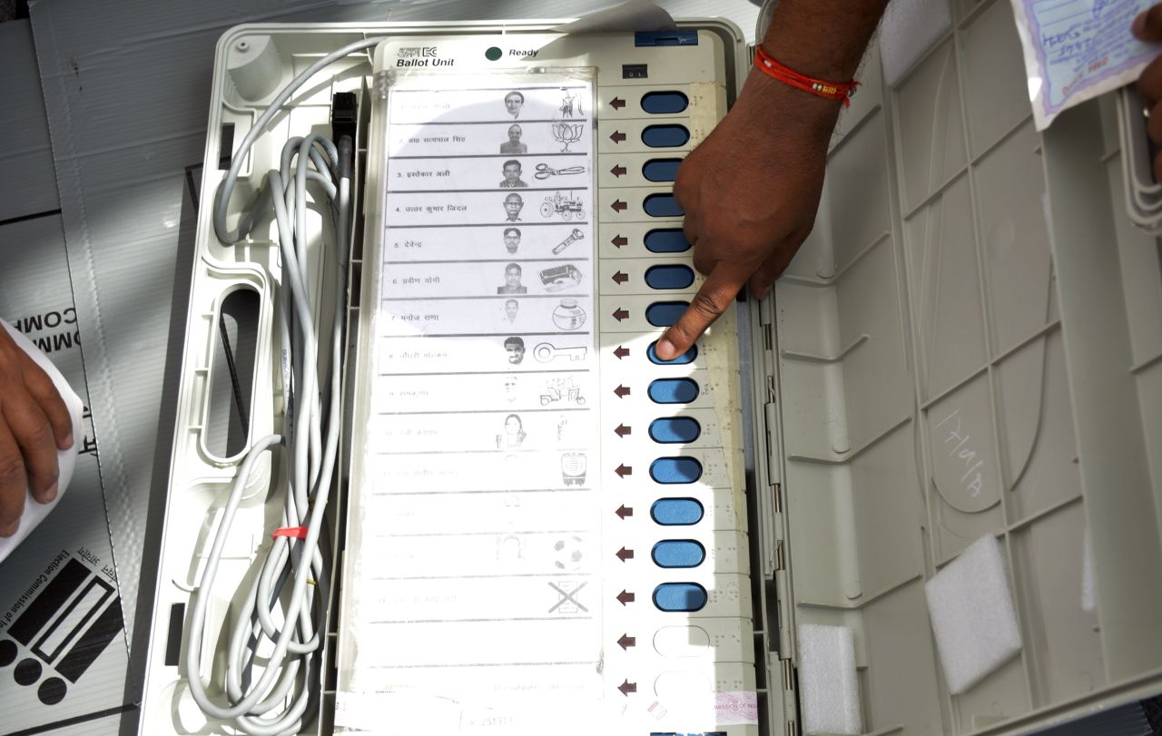 An electronic voting machine being used in the 2019 elections shows party symbols alongside candidates' names.