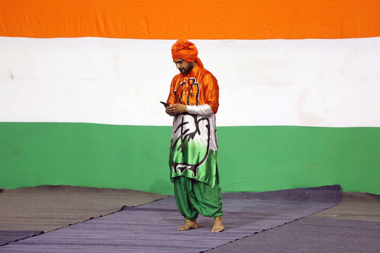 An attendee wearing clothing featuring the Indian National Congress (INC) party logo at an event in New Delhi, India, on March 11, 2019. 