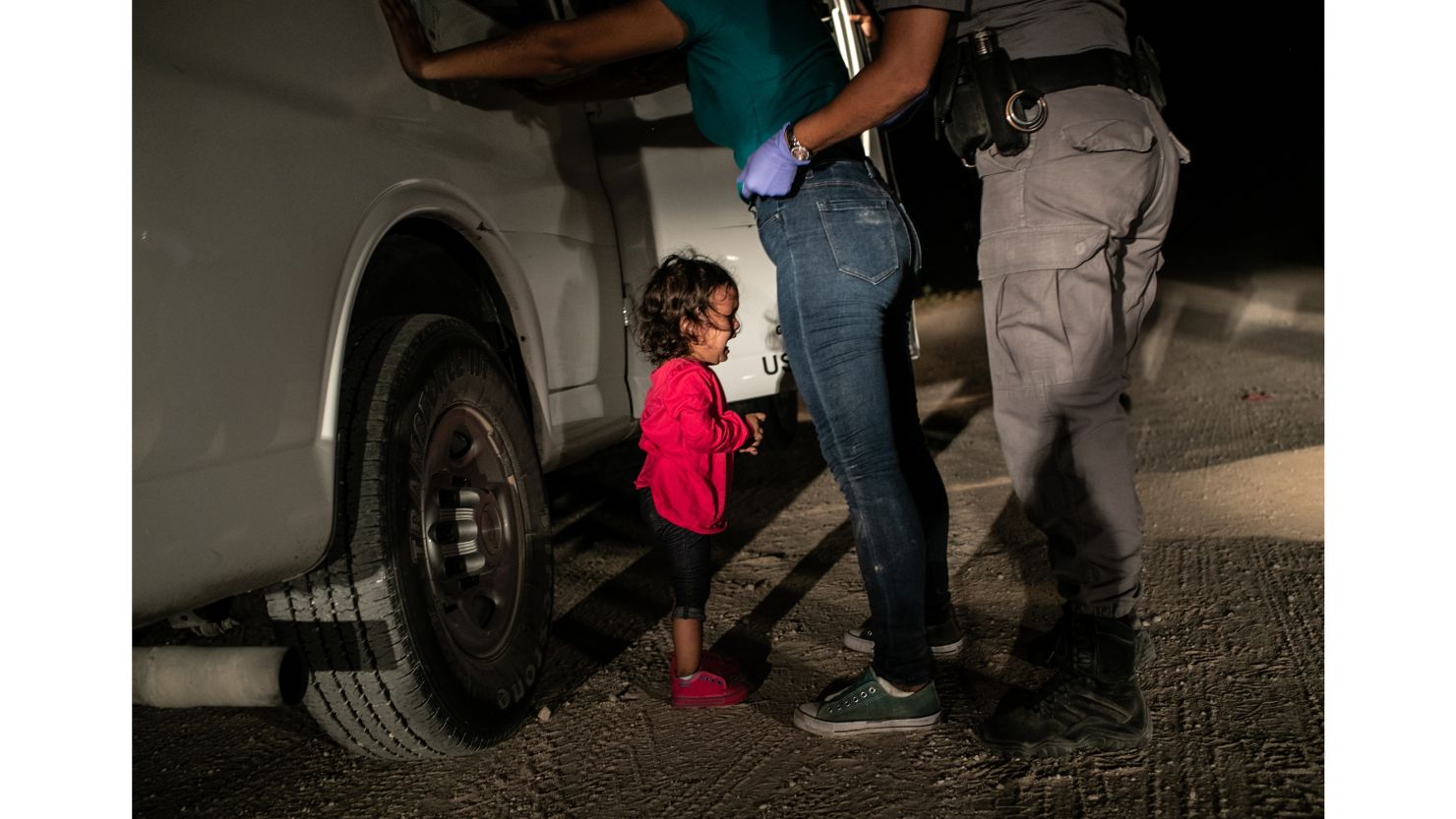 A 2-year-old Honduran girl cries as her mother is searched near the US-Mexico border on June 12. This photo won a World Press Photo prize on Thursday.
