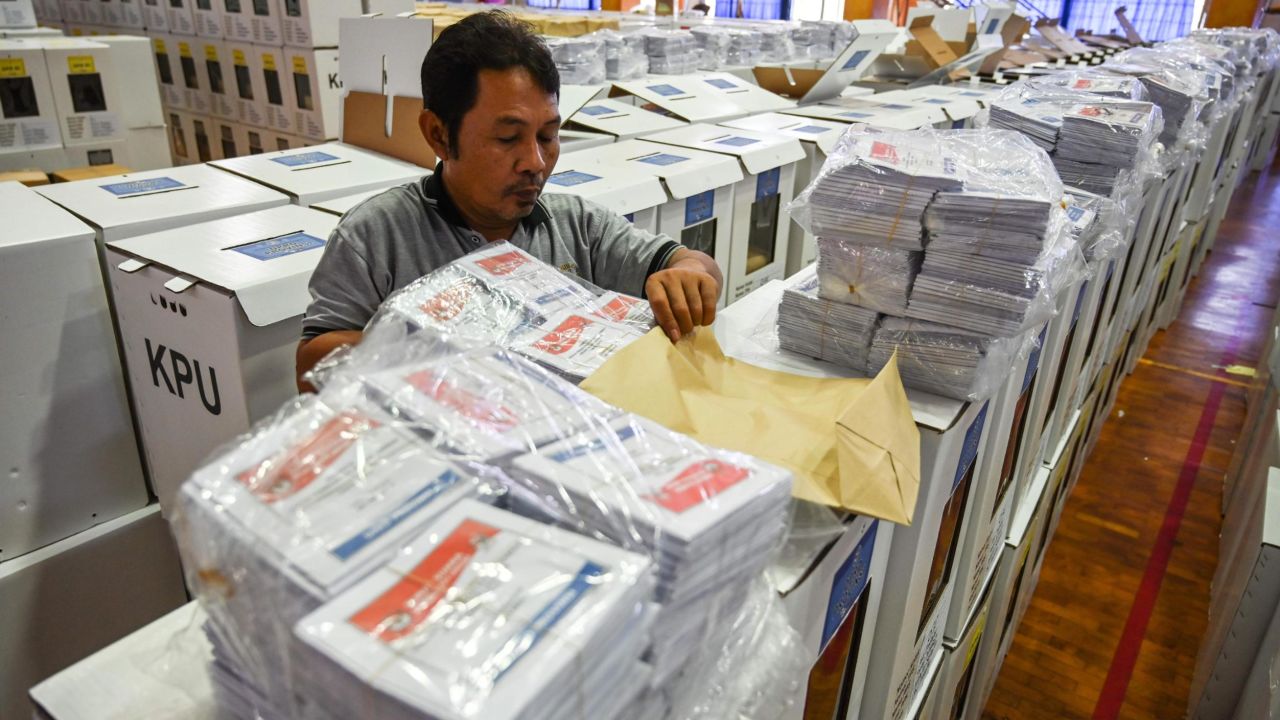 An official prepares ballot boxes and other voting materials in Jakarta ahead of presidential and legislative elections.