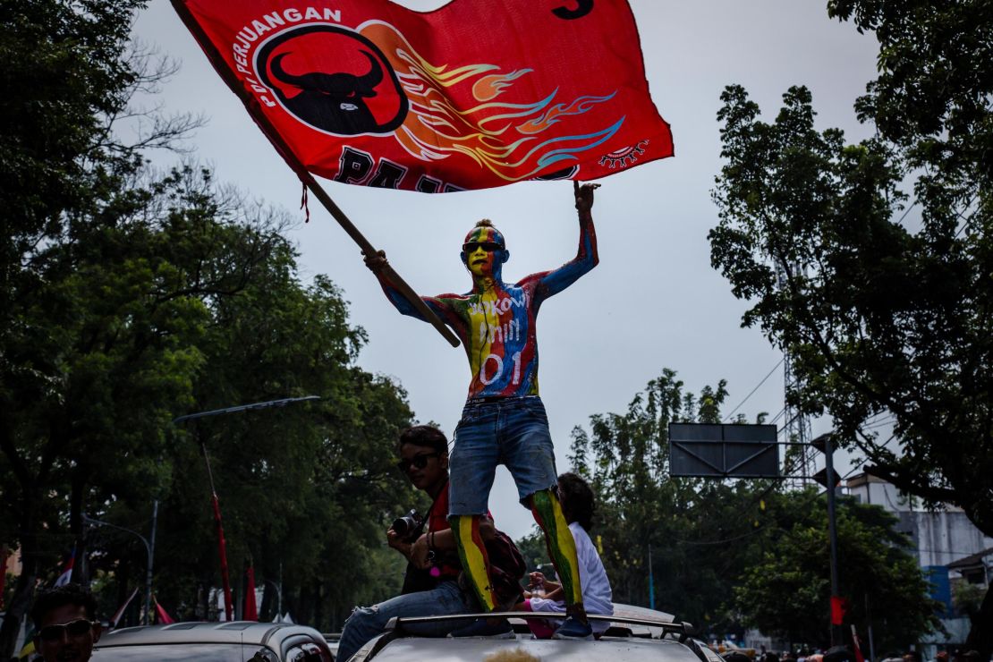 A supporter of Indonesian incumbent Presidential candidate Joko Widodo attends a campaign rally at the Sriwedari stadium in Solo, Central Java on April 9.