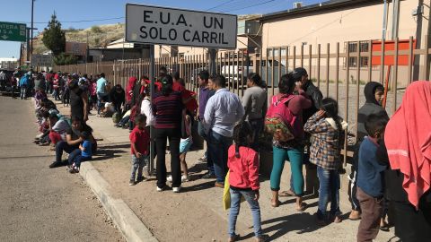 Migrants waited to be fed at a soup kitchen operated by the Kino Border Initiative in Nogales, Sonora. The wait to have an asylum bid heard at the border has soared since January.