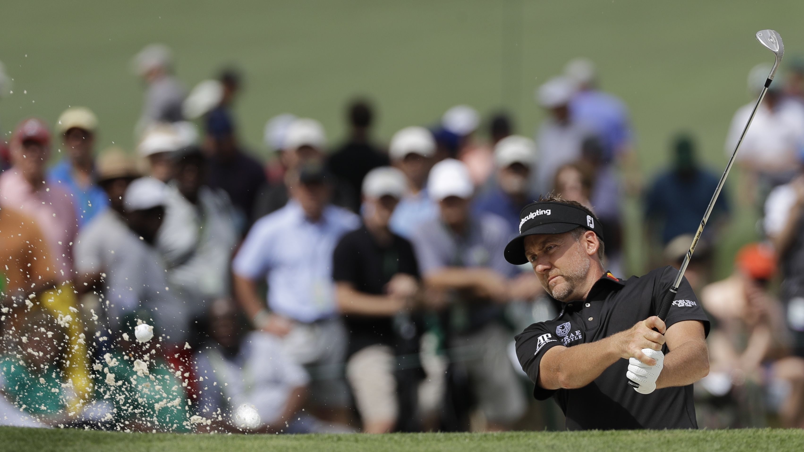 England's Ian Poulter kept up his challenge for a maiden major title with another good round at Augusta.