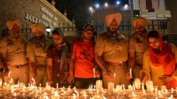 Indian Punjab Police light candles along with local residents as they pay tribute to victims of the Jallianwala Bagh massacre on the eve of the 100th anniversary.