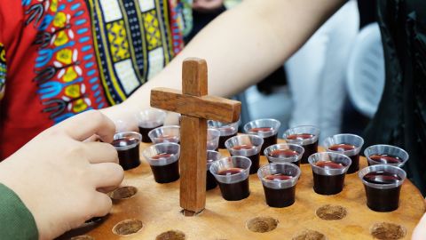 The congregation is offered grape juice during Communion at the Bread of Life.