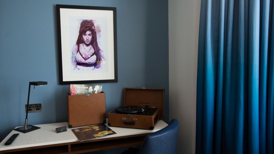 <strong>Individual art in each room: </strong>An artwork depicting Amy Winehouse hangs above a vinyl record player in one of the hotel rooms.