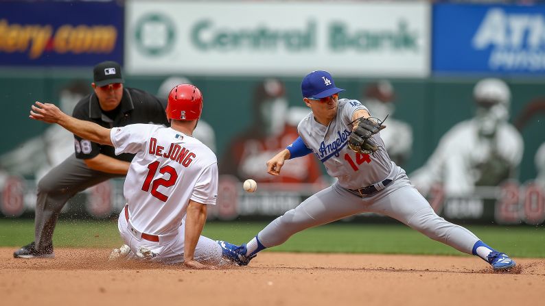 St. Louis Cardinals shortstop Paul DeJong (12) steals second against Los Angeles Dodgers right fielder Enrique Hernandez (14) during the fifth inning at Busch Stadium on April 11.