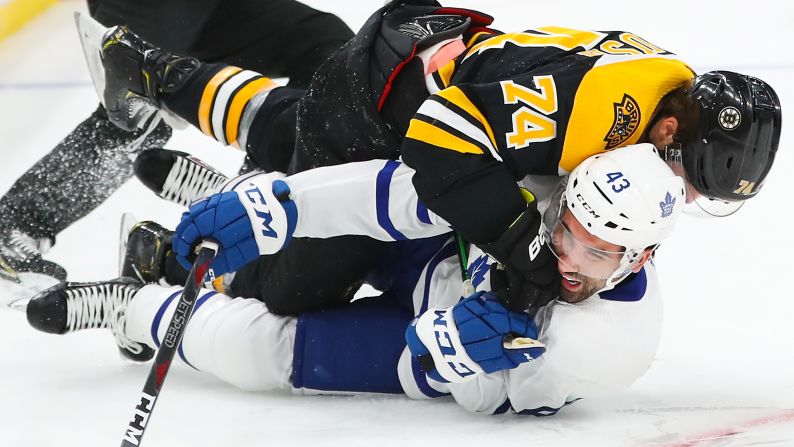 Jake DeBrusk (74) of the Boston Bruins lands a punch on Nazem Kadri (43) of the Toronto Maple Leafs in the second game of the first round of the 2019 NHL Stanley Cup Playoffs at TD Garden on April 13 in Boston.