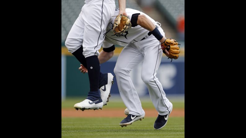 Detroit Tigers starting pitcher Matthew Boyd, left, interferes with Detroit Tigers third baseman Gordon Beckham and allows Cleveland Indians' Leonys Martin to safely reach first during the first inning  on April 10 in Detroit. 