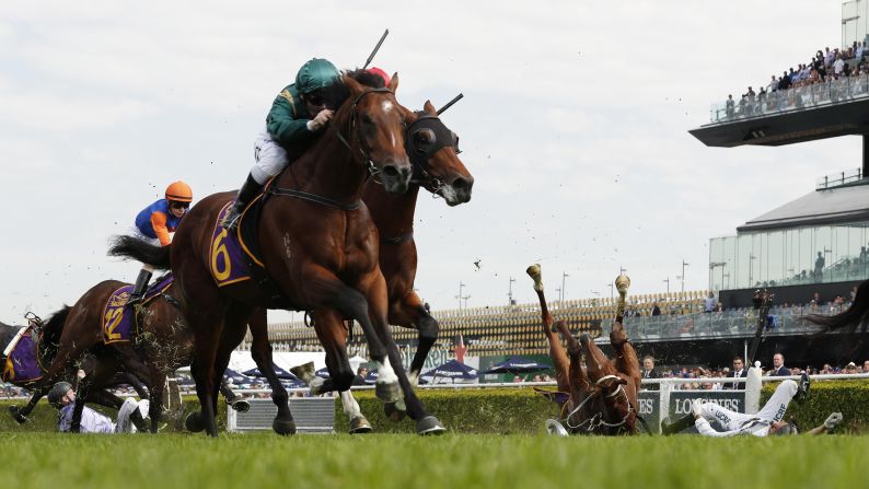 Andrew Adkins riding War Baron, right, and Glyn Schofield riding Persan, left, fall during race 1 of the Kings Of Sydney Sport Mile during The Championships Day 2 at Royal Randwick Racecourse on April 13 in Sydney.