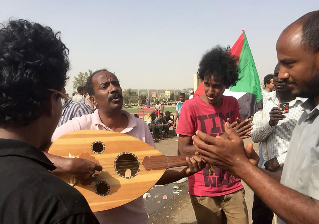 Demonstrators play music in Khartoum.