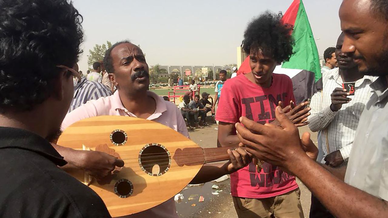 Demonstrators play music in Khartoum.