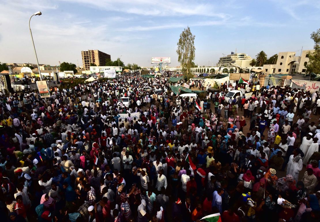 Sudanese demonstrators gather near the military headquarters in the capital Khartoum on April 14, 2019.