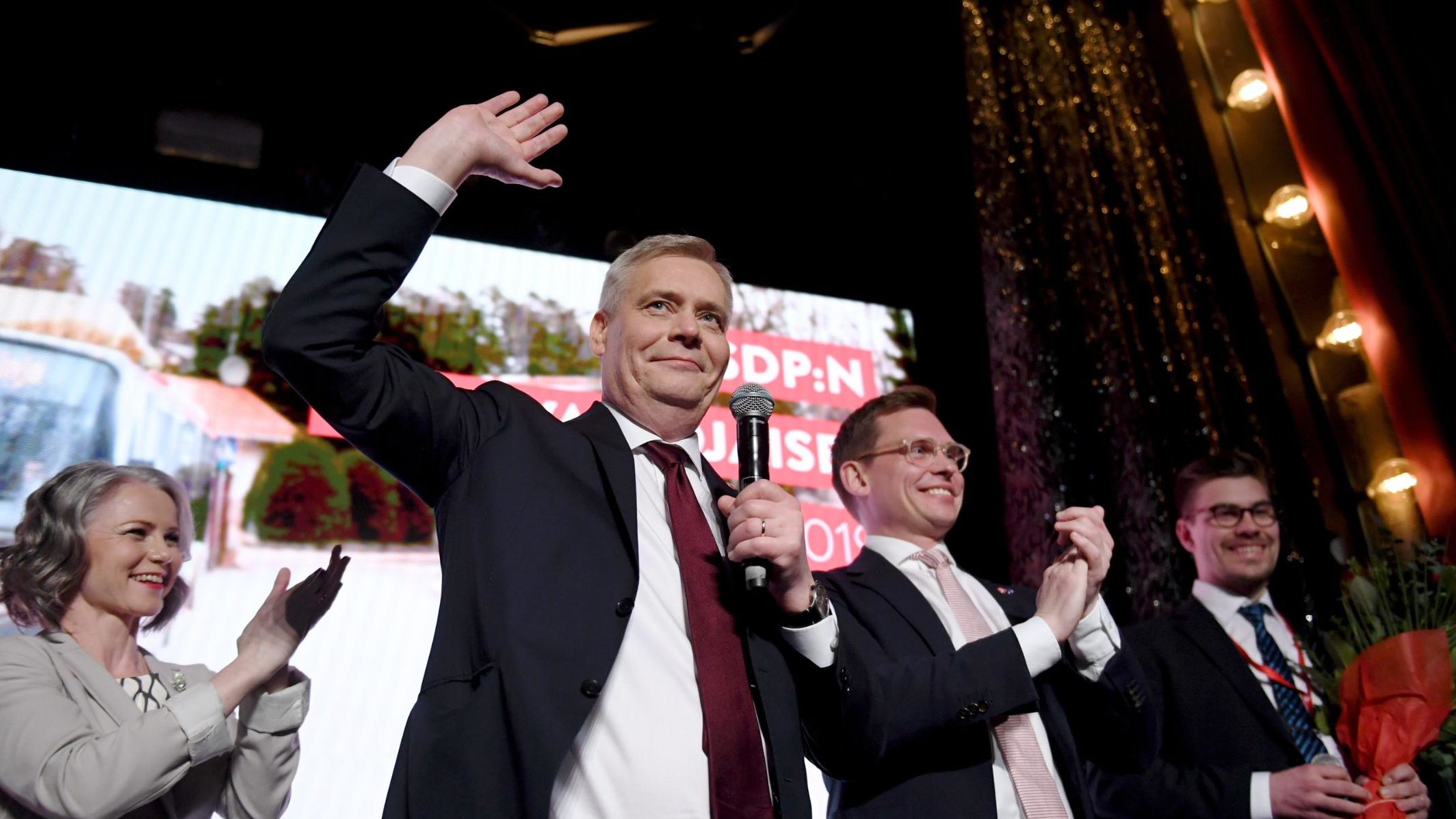 Chairman of the Finnish Social Democratic Party Antti Rinne (center) his wife Heta Ravolainen-Rinne (left) and Party Secretary Antton Rönnholm (second right) celebrate at their election party in Helsinki, Finland on April 14, 2019.