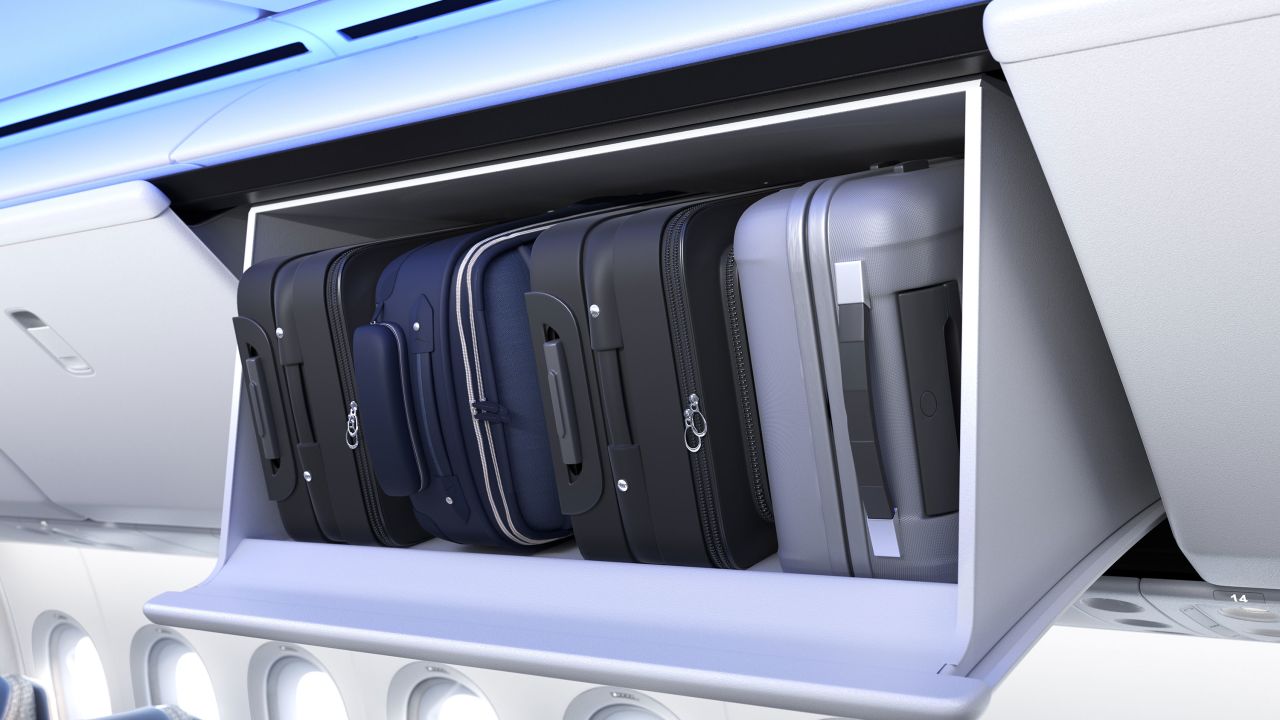 <strong>Overhead bin: </strong>The side walls of the airplane have been sculpted. Overhead bins appear small, but are actually more spacious than they look. 