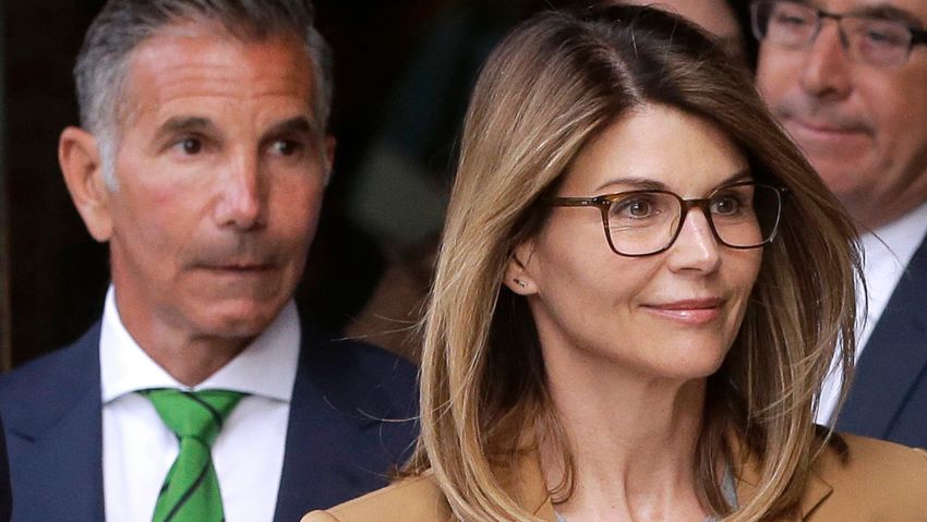 Actress Lori Loughlin, front, and husband, clothing designer Mossimo Giannulli, left, depart federal court in Boston on Wednesday, April 3, 2019, after facing charges in a nationwide college admissions bribery scandal. (AP Photo/Steven Senne)