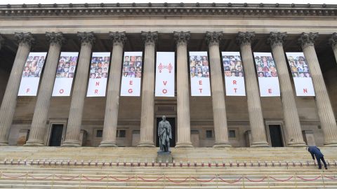 A banner is hung outside Liverpool's St. George's Hall with pictures of the fans who lost their lives in the Hillsborough disaster.
