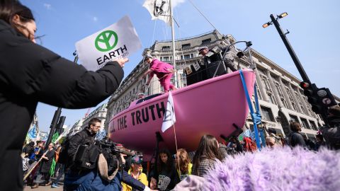 A pink sailboat with the message "TELL THE TRUTH" blocks Oxford Circus.
