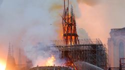 Smoke and flames rise during a fire at the landmark Notre-Dame Cathedral in central Paris on April 15, 2019, potentially involving renovation works being carried out at the site, the fire service said. - A major fire broke out at the landmark Notre-Dame Cathedral in central Paris sending flames and huge clouds of grey smoke billowing into the sky, the fire service said. The flames and smoke plumed from the spire and roof of the gothic cathedral, visited by millions of people a year, where renovations are currently underway.
