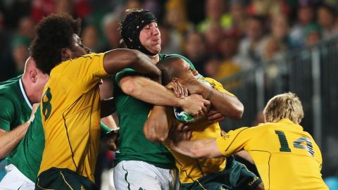 Stephen Ferris tackles Australia's Will Genia at the 2011 World Cup