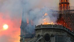 Smoke billows as flames destroy the roof of the landmark Notre-Dame Cathedral in central Paris on April 15, 2019. - A major fire broke out at the landmark Notre-Dame Cathedral in central Paris sending flames and huge clouds of grey smoke billowing into the sky, the fire service said. The flames and smoke plumed from the spire and roof of the gothic cathedral, visited by millions of people a year, where renovations are currently underway. (Photo by FRANCOIS GUILLOT / AFP)        (Photo credit should read FRANCOIS GUILLOT/AFP/Getty Images)