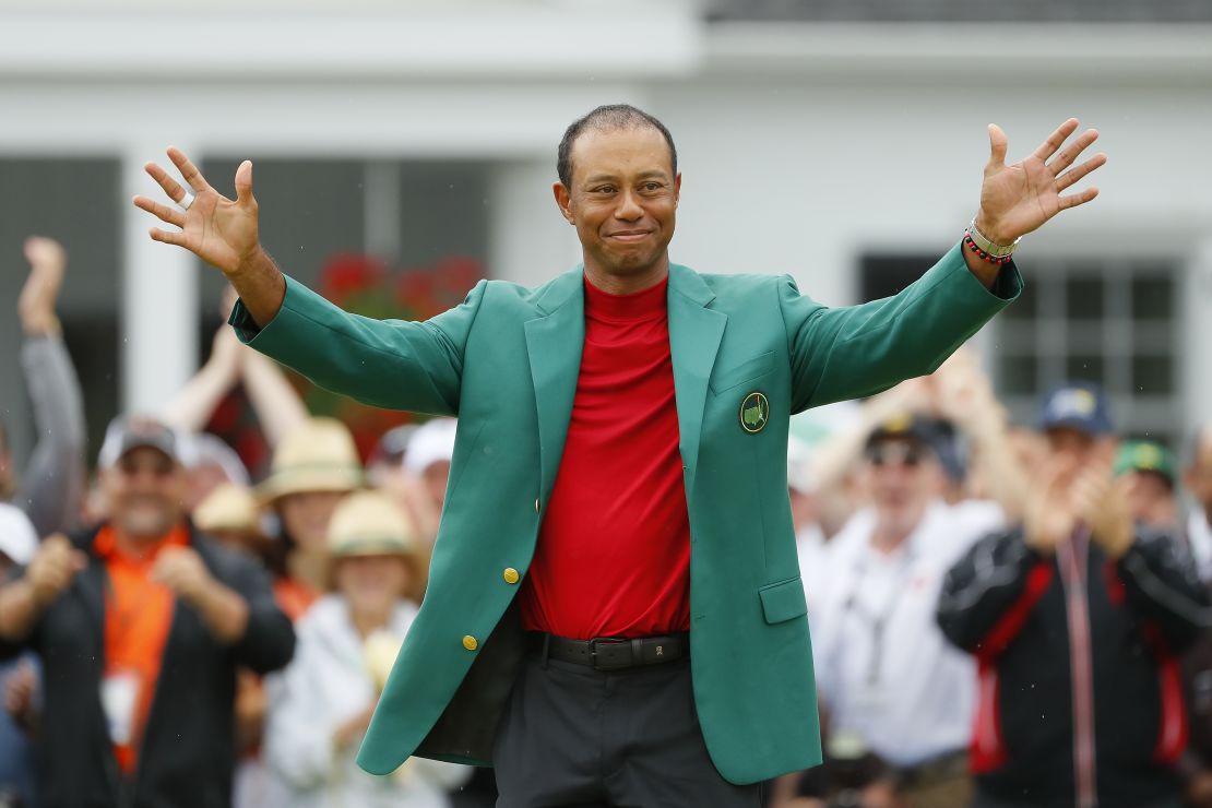 Tiger Woods smiles after being awarded the Green Jacket.