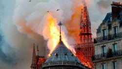 TOPSHOT - Smoke and flames rise during a fire at the landmark Notre-Dame Cathedral in central Paris on April 15, 2019, potentially involving renovation works being carried out at the site, the fire service said. (Photo by FRANCOIS GUILLOT / AFP)