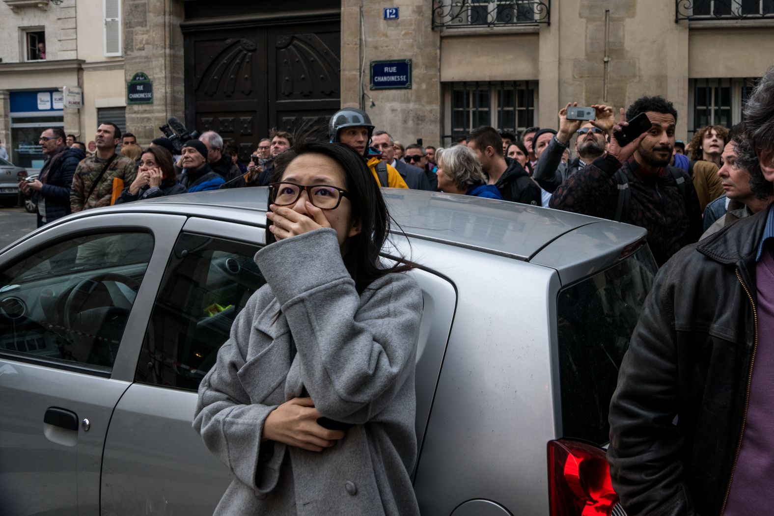 Horrified bystanders react to the fire.