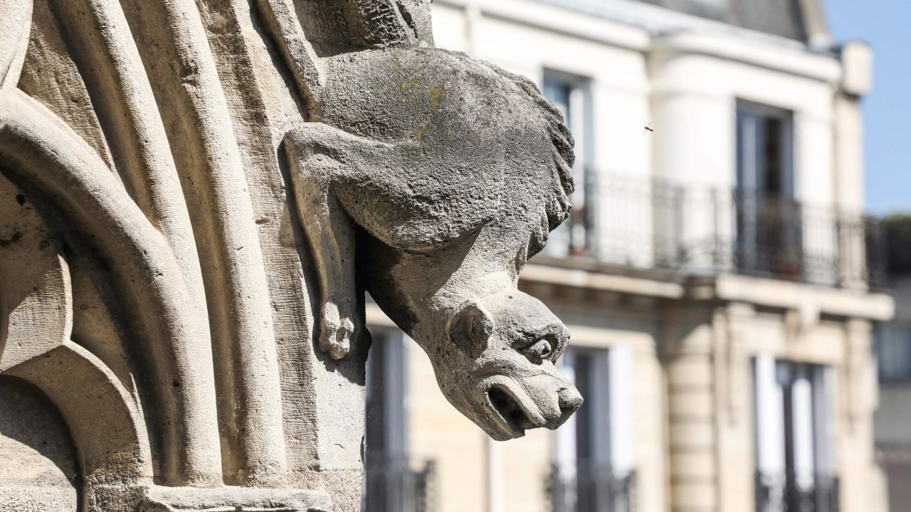 A gargoyle adorns the exterior of Notre Dame Cathedral.