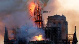 The steeple collapses as smoke and flames engulf the Notre-Dame Cathedral in Paris on April 15, 2019. - A huge fire swept through the roof of the famed Notre-Dame Cathedral in central Paris on April 15, 2019, sending flames and huge clouds of grey smoke billowing into the sky. The flames and smoke plumed from the spire and roof of the gothic cathedral, visited by millions of people a year. A spokesman for the cathedral told AFP that the wooden structure supporting the roof was being gutted by the blaze. (Photo by Geoffroy VAN DER HASSELT / AFP)        (Photo credit should read GEOFFROY VAN DER HASSELT/AFP/Getty Images)