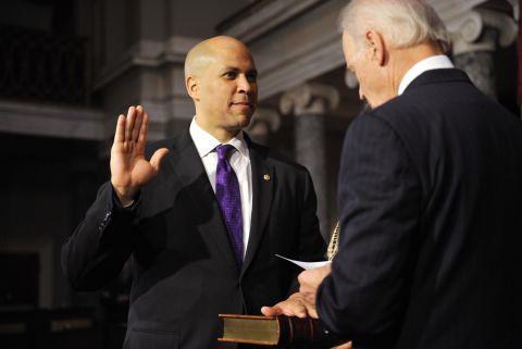 Booker takes the oath of office from Vice President Joe Biden during a ceremonial swearing-in at the US Capitol.