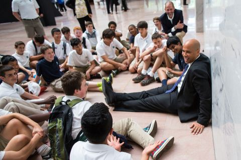 Booker meets with eighth-graders during their end-of-year trip to Washington in May 2016.