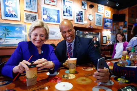 Booker campaigns with Democratic presidential candidate Hillary Clinton at a cafe in Newark in June 2016.