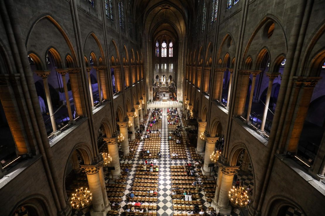 This photograph taken on June 26, 2018, shows worshippers as they arrive to take part in a mass at Notre Dame Cathedral in Paris. 