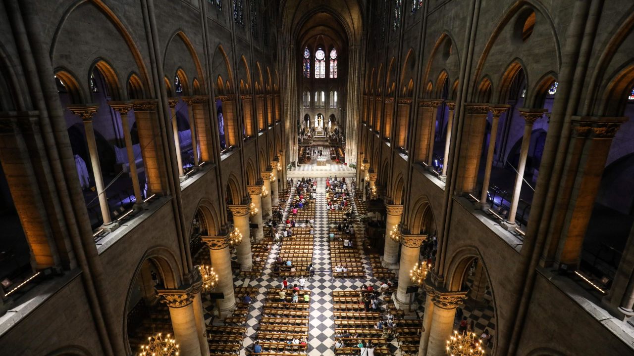 TOPSHOT - This photograph taken on June 26, 2018, shows worshippers as they arrive to take part in a mass at Notre Dame de Paris Cathedral in Paris. (Photo by Ludovic MARIN / AFP)        (Photo credit should read LUDOVIC MARIN/AFP/Getty Images)