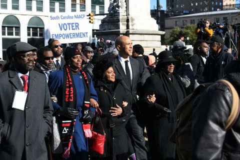 Booker walks with NAACP leaders during a Martin Luther King Jr. Day march in Columbia, South Carolina, in January 2019.