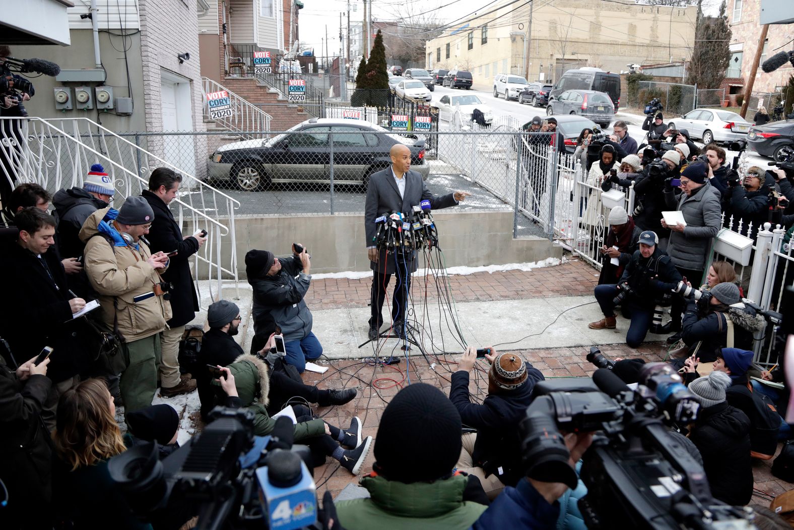 After announcing that he would be running for president, Booker speaks to the press outside his home in Newark in February 2019.