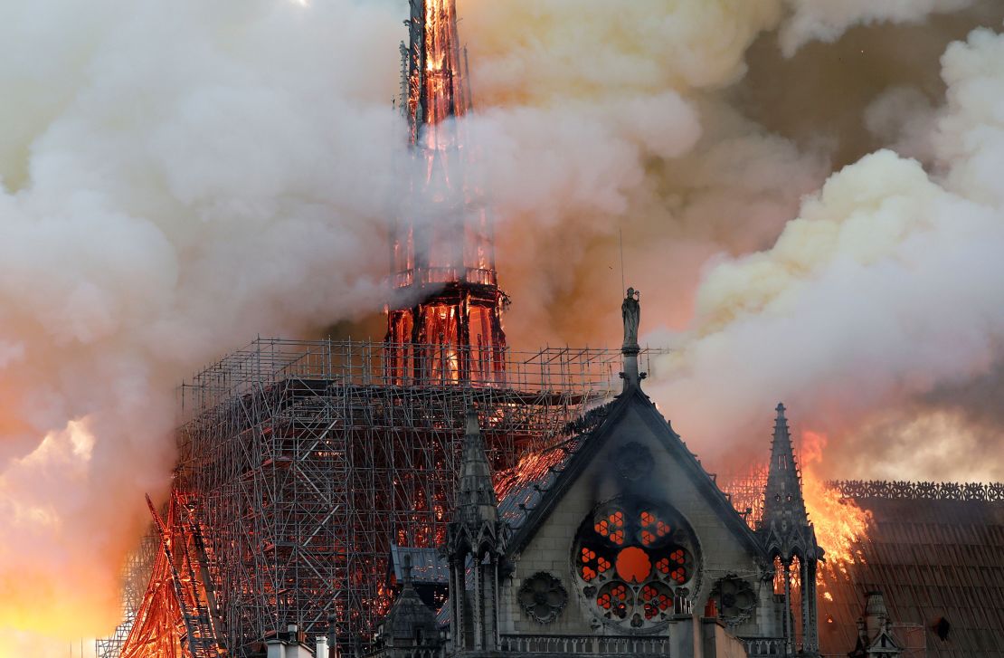 Smoke billows as fire engulfs the cathedral's roof and spire on April 15, 2019.