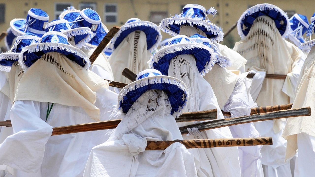 Masquerades appear at Nigerian festivities.