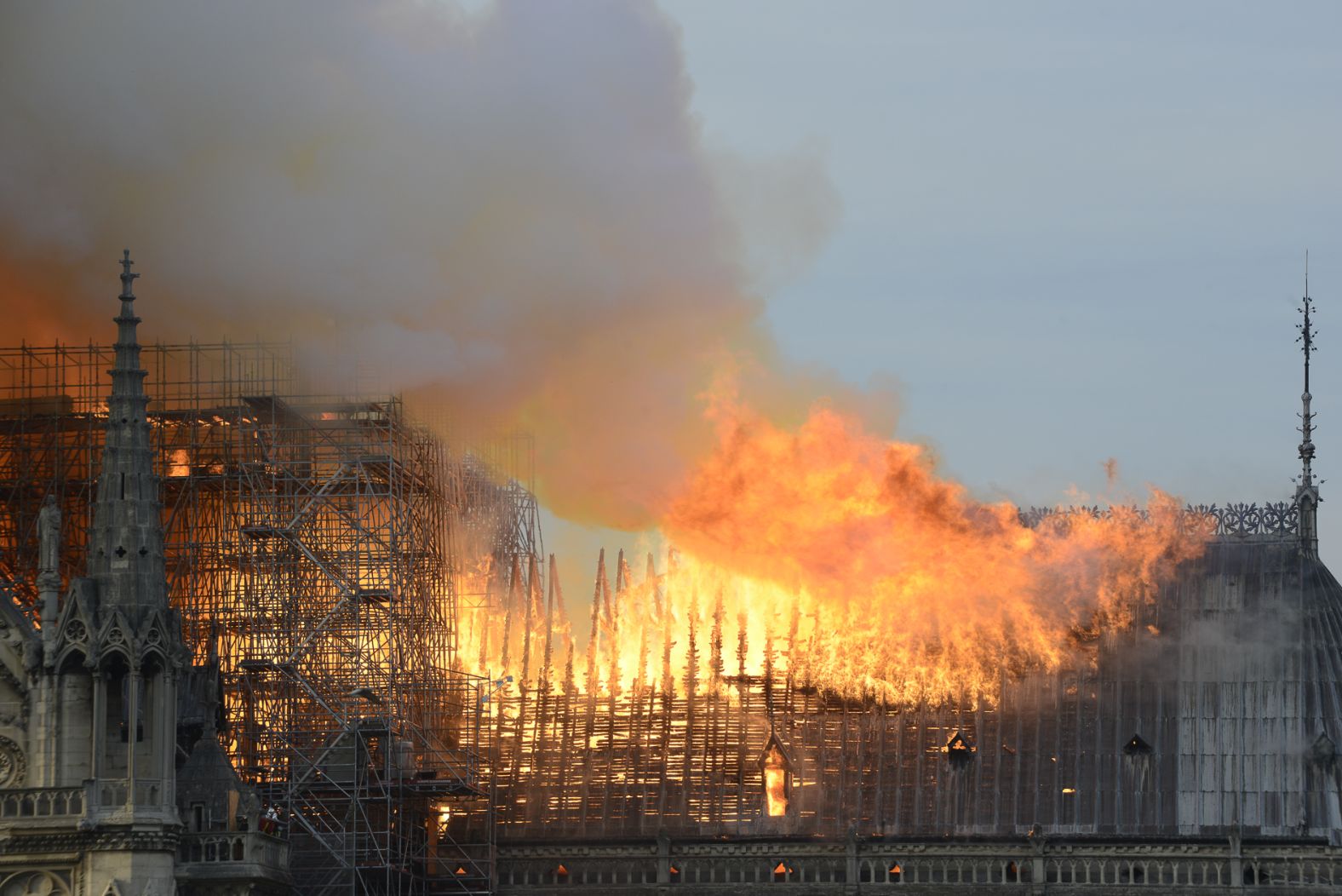 Flames roar across the roof of the cathedral. 