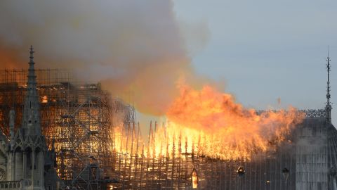 Flames roar across the roof of the cathedral. 